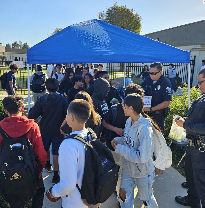 SAPD Officers passing out treats to our Falcons