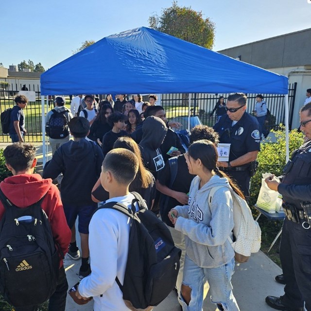 SAPD Officers passing out treats to our Falcons